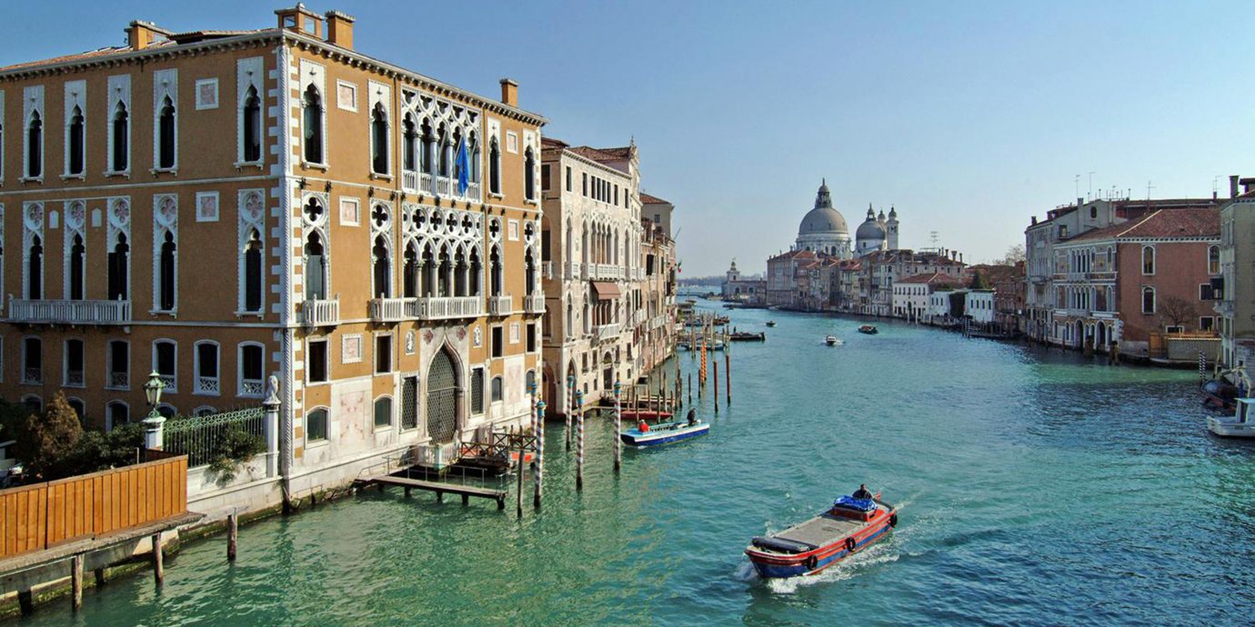Hotels Italy Luxury Travel Trip Ideas Venice water sky Boat outdoor Canal landform geographical feature body of water Town waterway vehicle vacation River tourism channel gondola Sea cityscape Harbor traveling